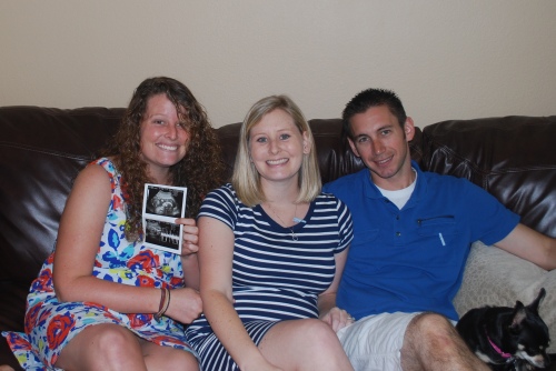 Me holding baby Wolk's sonogram, Lauren and Jason
